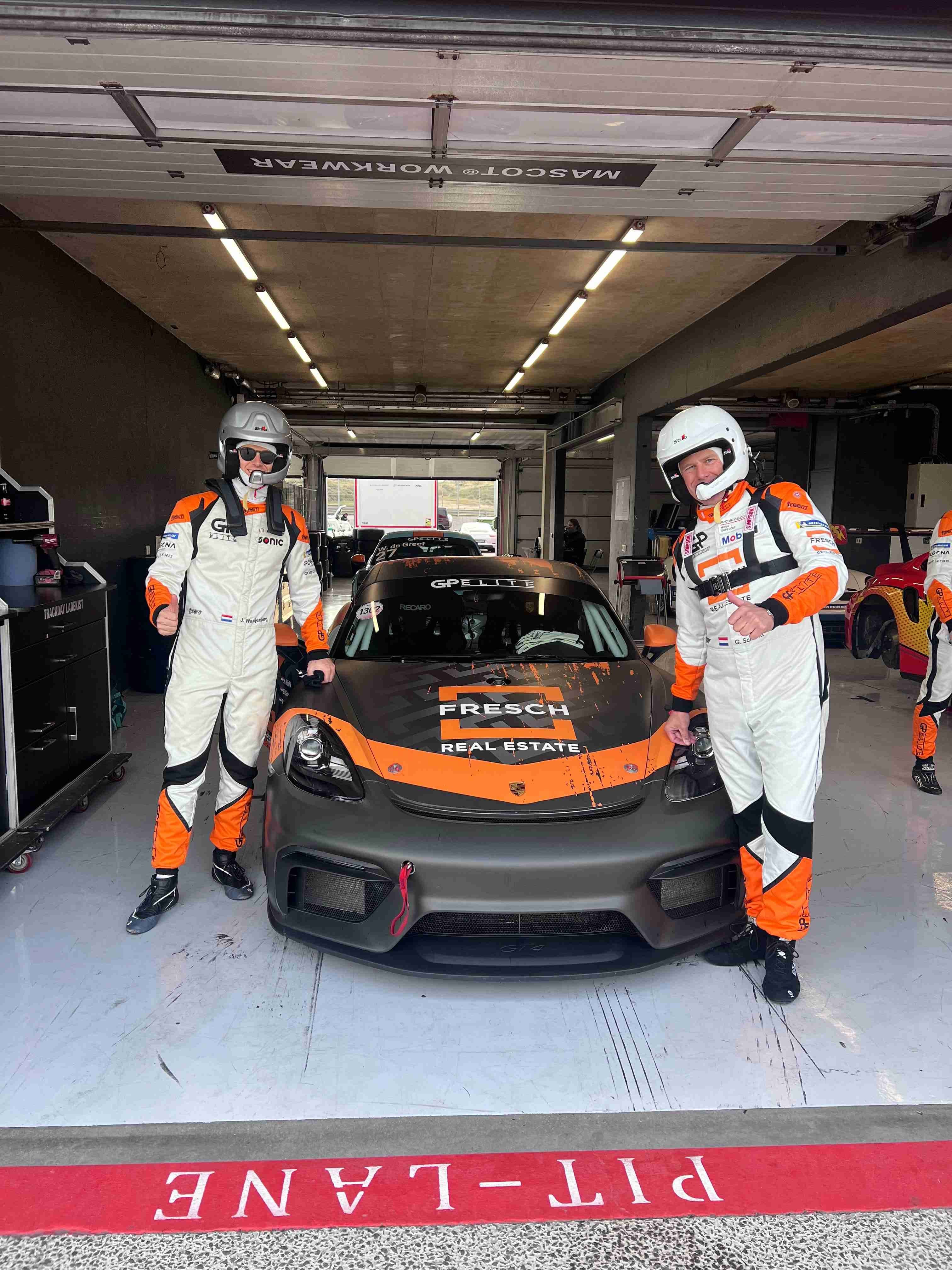 Professional McLaren GT racing team in garage